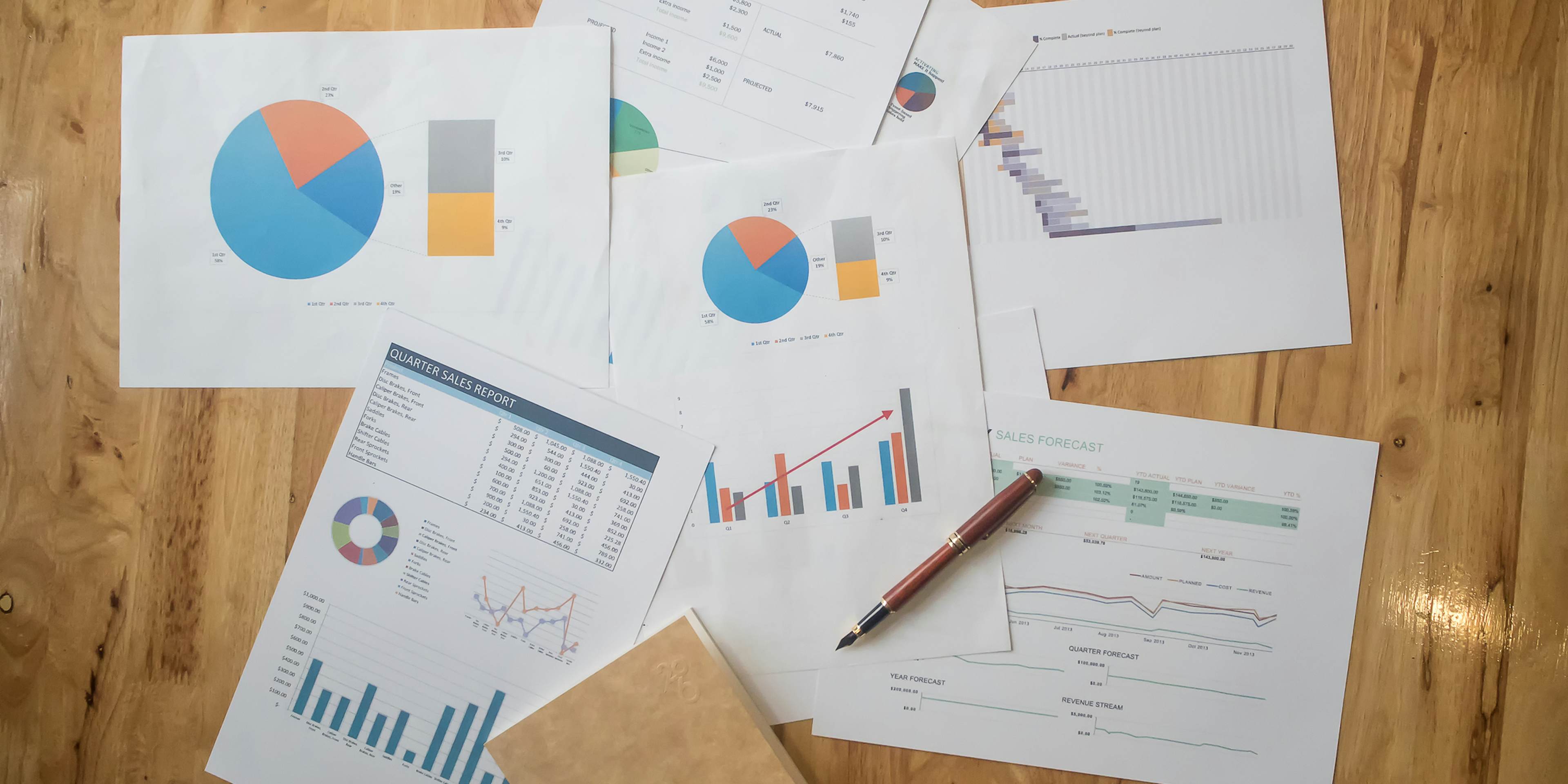 papers on the floor displaying graphs and charts