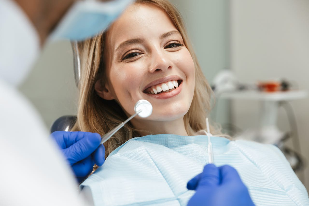 women smiling at dentist office