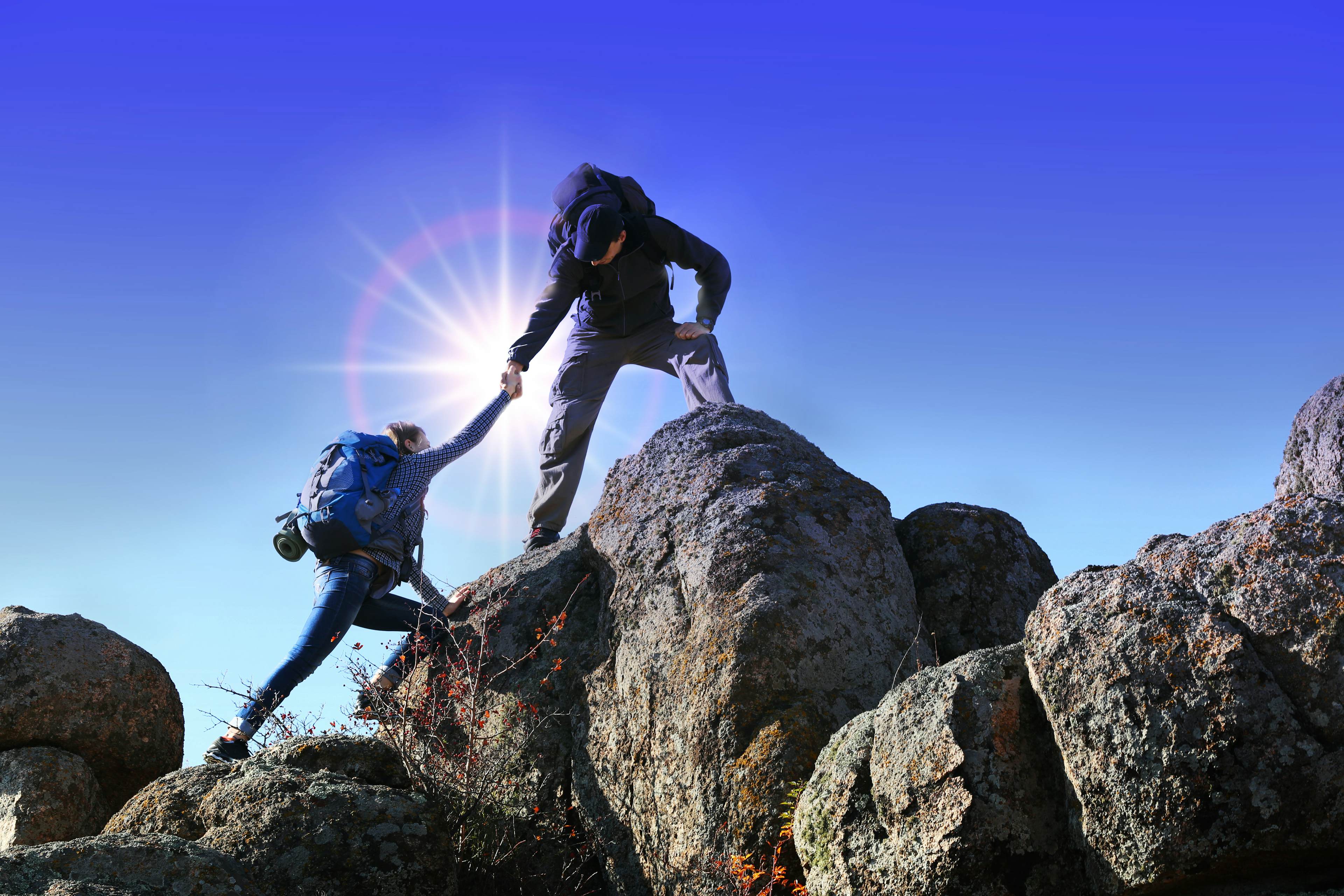 people rock climbing