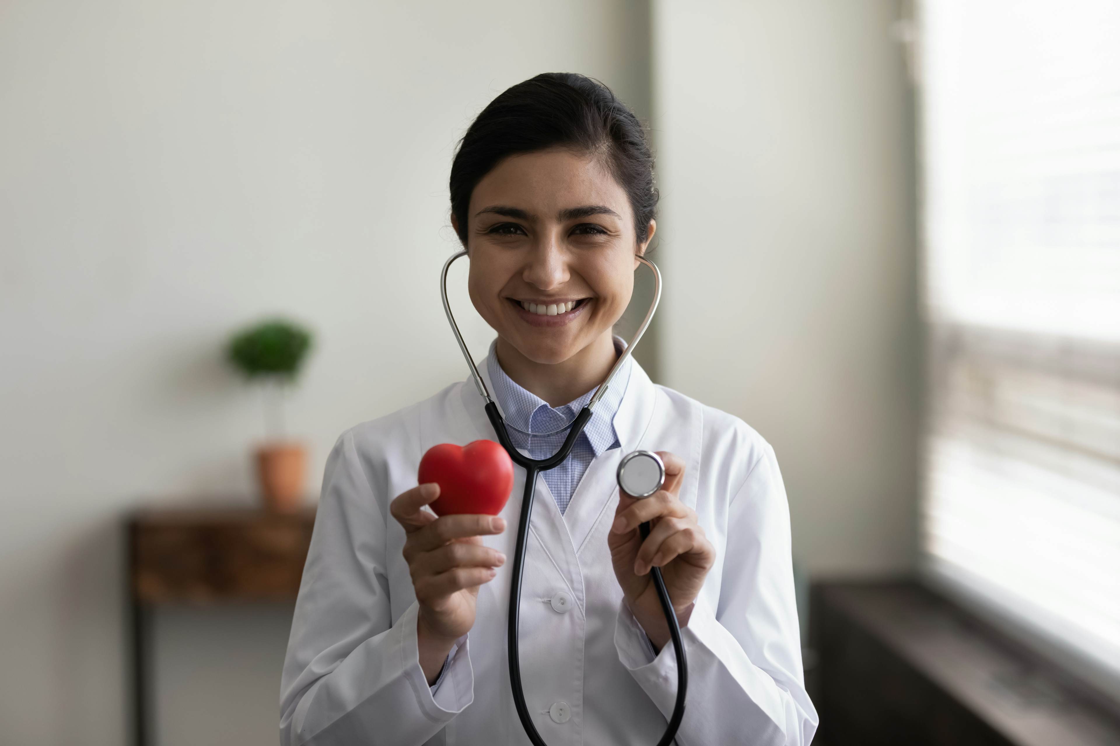 Doctor with stethoscope and apple