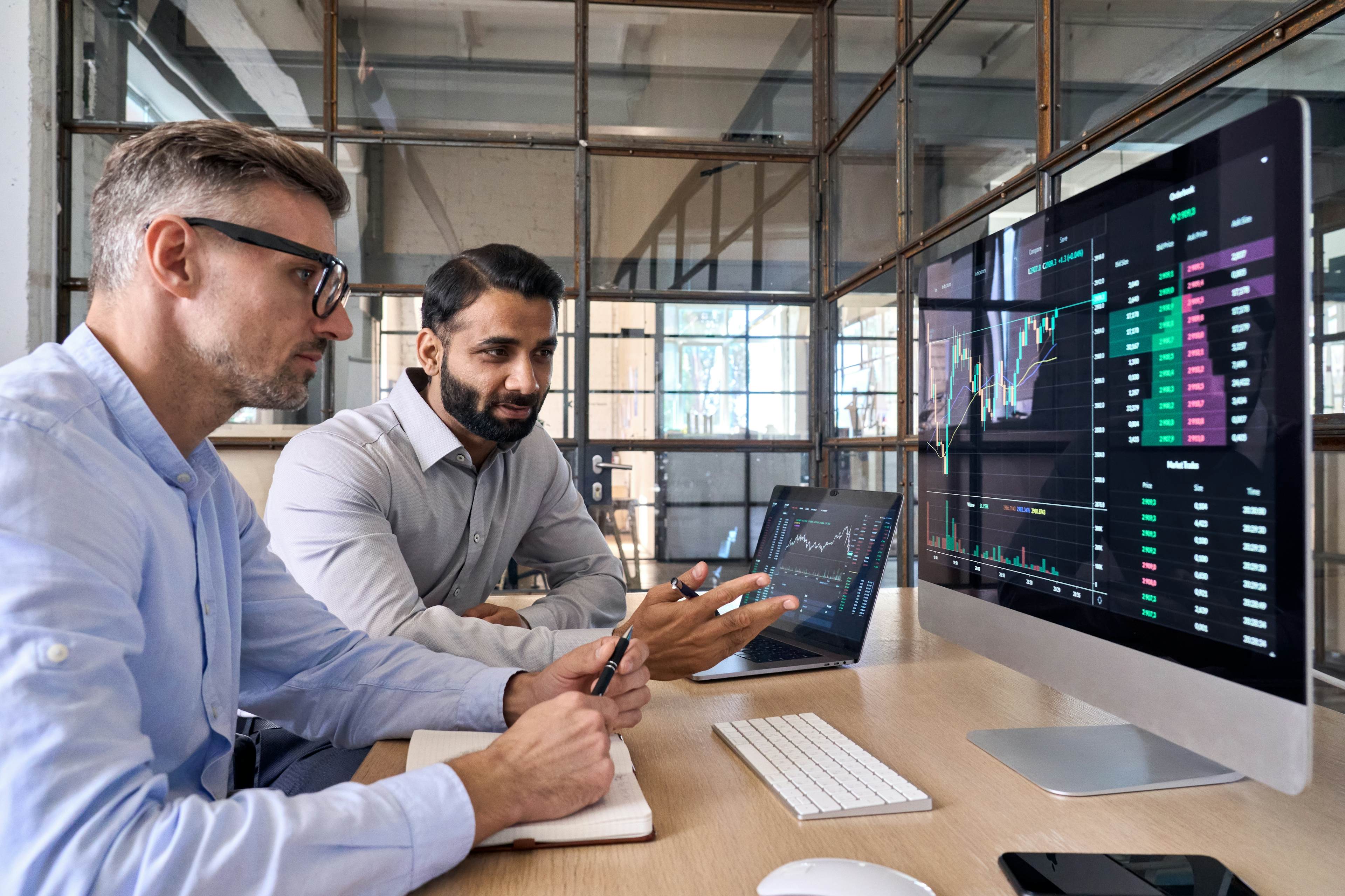 Two men looking at data