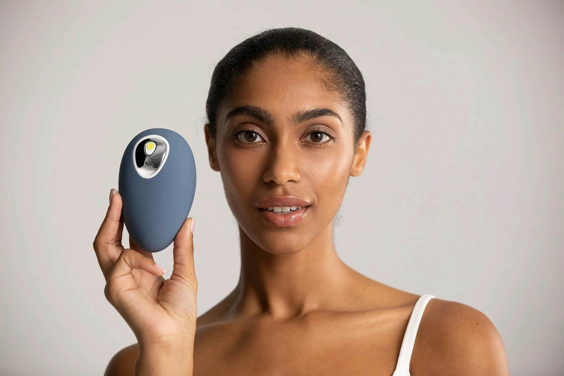 Woman holding up Droplette Micro Infuser