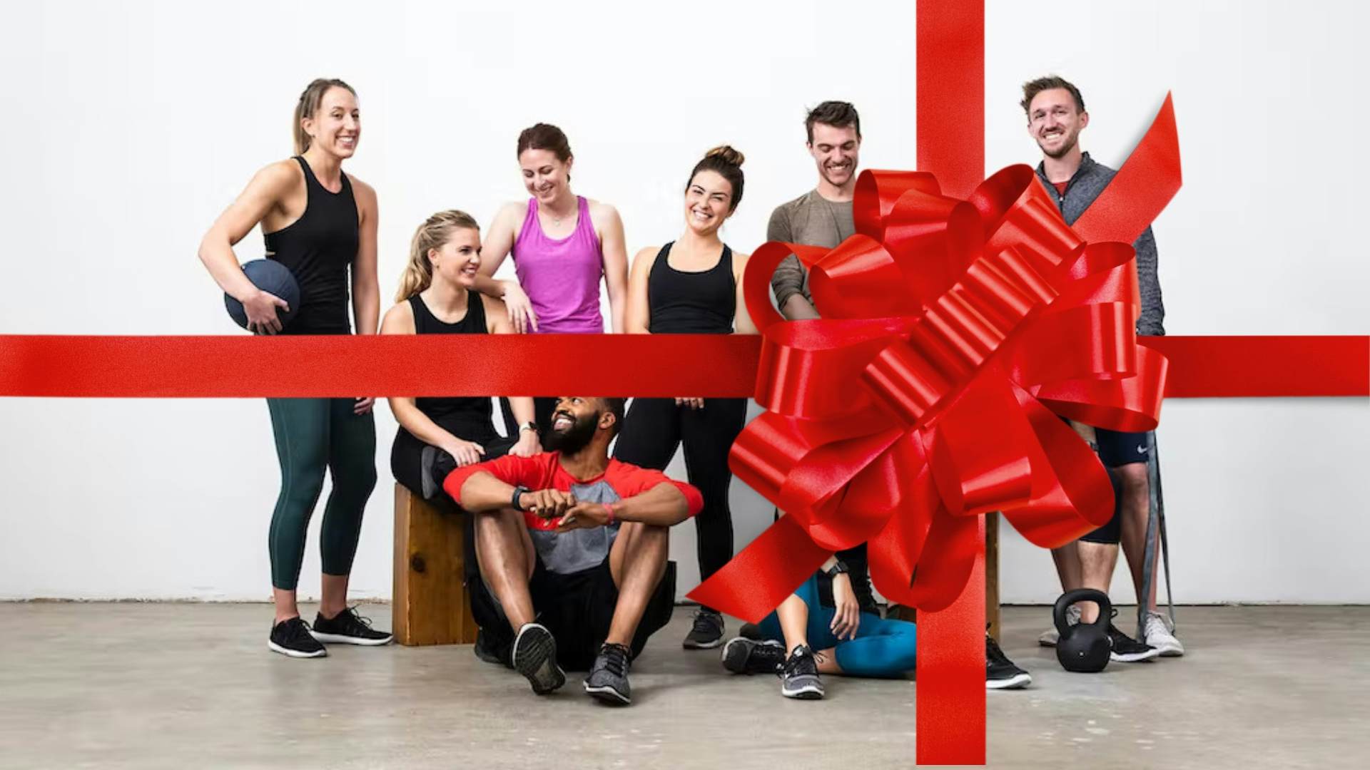 Group of personal trainers with bow