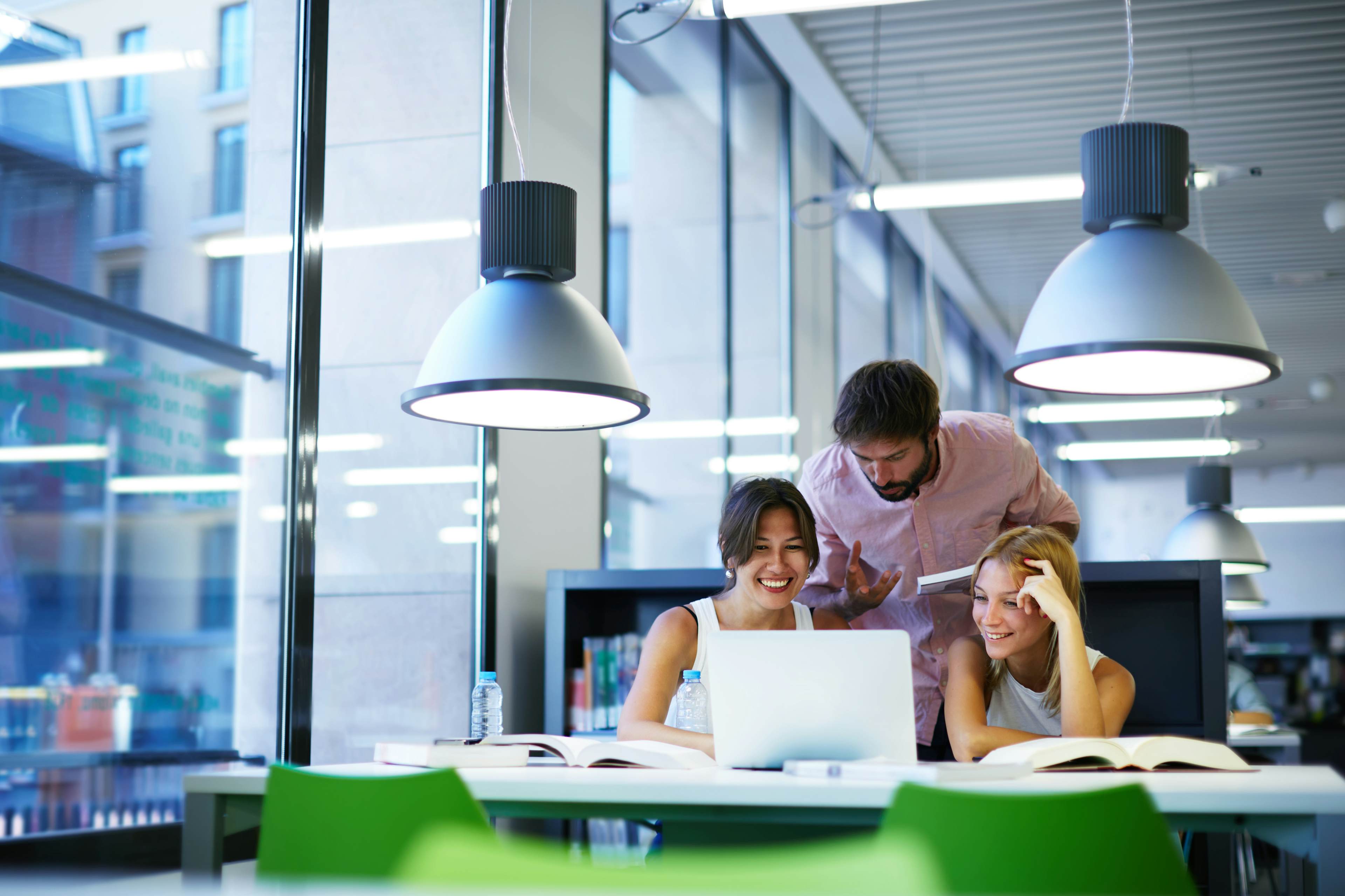 Students studying happily in the library