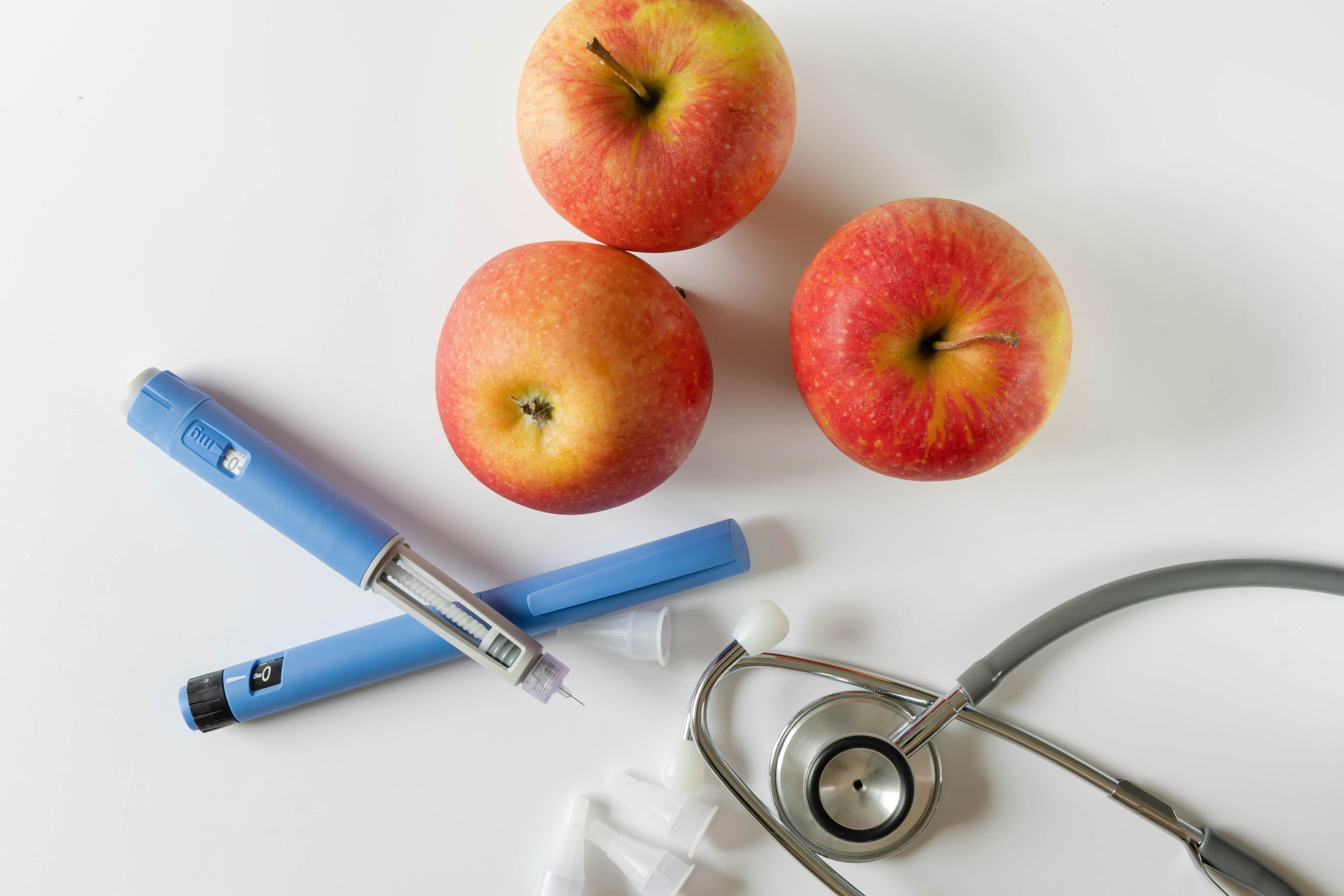 Apples, syringes, and stethoscope.