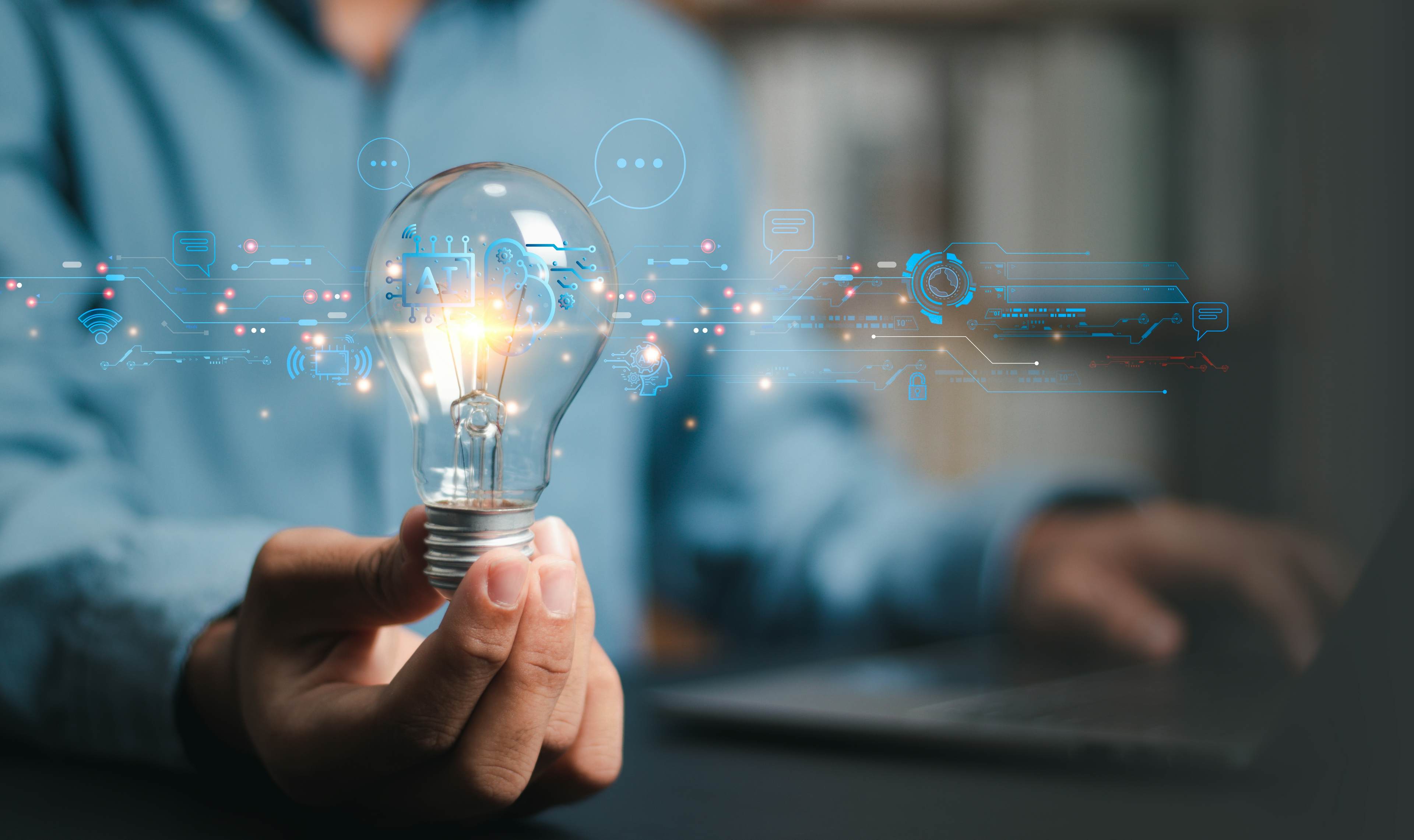 Light bulb surrounded by technology graphics and ideas