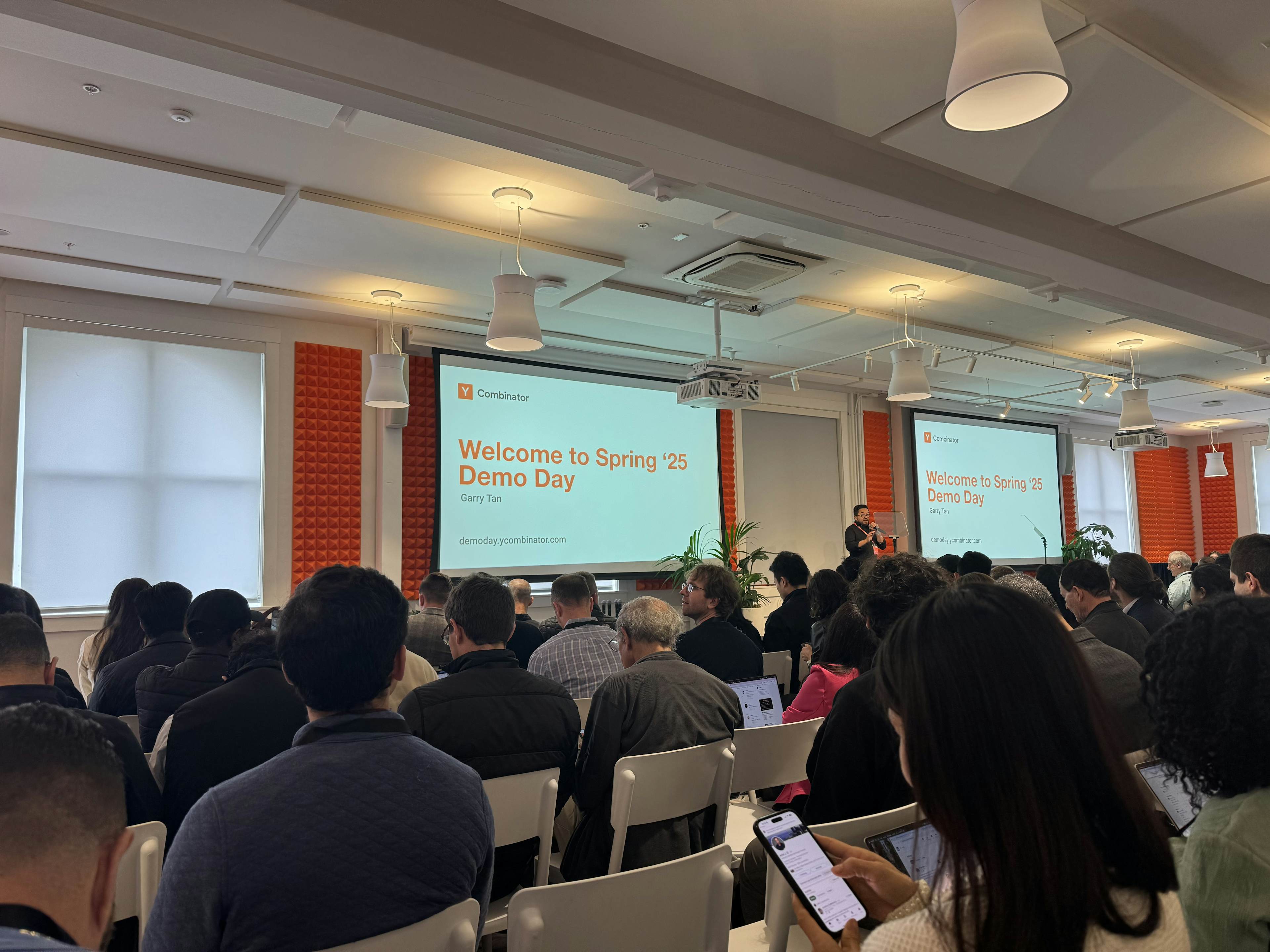 Audience attends Y Combinator Spring 2025 Demo Day as Garry Tan presents on stage
